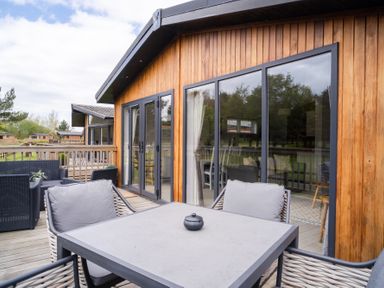An outdoor seating area with a table and chairs at The View in Waltham
