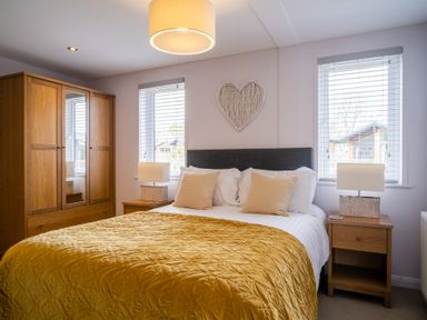 A bedroom with a bed and wardrobe at The View in Waltham