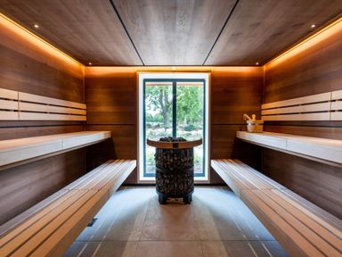 A sauna with wooden benches and a window at The View in Waltham