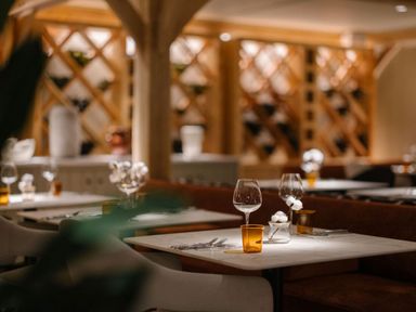 A dining room with tables and glassware at The View in Waltham