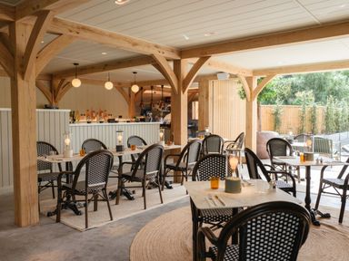 A dining room with tables and chairs at Macosi in Waltham