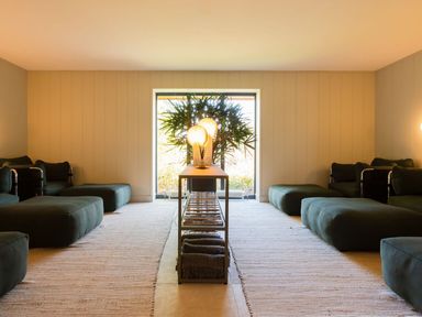 A living room with sofas and a table at The Luxury Retreat in Waltham