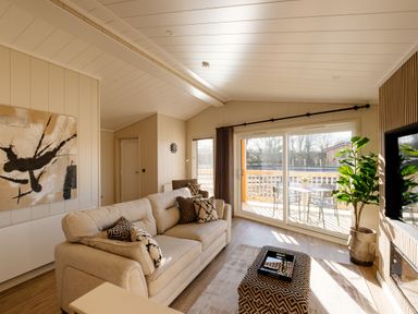 A living room with a sofa and sliding door at Luxury Boutique Retreat Spa Waltham