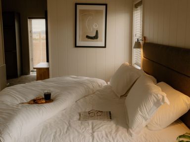 A bedroom with a bed, coffee, and glasses at Luxury Boutique Retreat Spa in Waltham