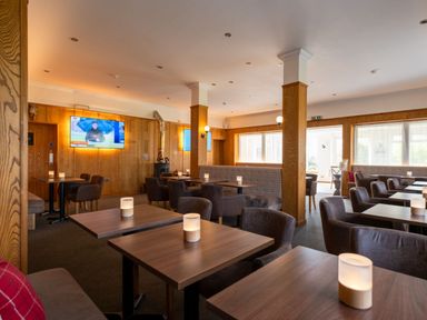 A dining room with tables and chairs at Exclusive Aura Spa in Waltham