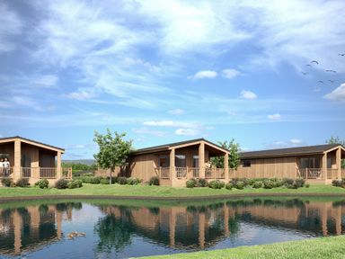 Cabins surrounding a pond at Luxury Boutique Retreat Pet in Waltham