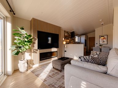 A living room with a television and fireplace at Luxury Boutique Retreat Pet Waltham