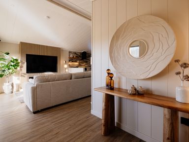 A living room with a sofa and television at Luxury Boutique Retreat Pet in Waltham