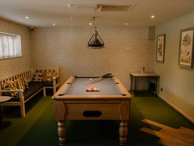 A games room with a pool table and seating area at St Ives Lodge 3 Spa Praze-An-Beeble