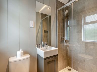 A bathroom with a sink and shower at Argel Spa in Praze-An-Beeble