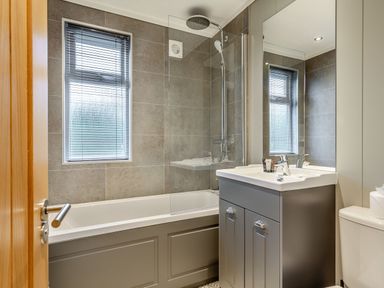 A bathroom with a bathtub and shower at Argel Spa in Praze-An-Beeble