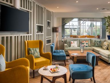 A lounge with seating and a coffee table at Argel Spa in Praze-An-Beeble