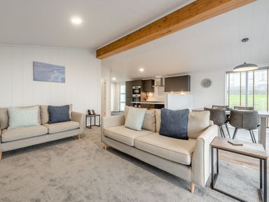 A living room with sofas and a coffee table at Sonnet 3 Spa (Pet) (Roof Terrace) in Laugharne
