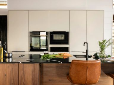 A kitchen with an island and appliances at Solace in Laugharne