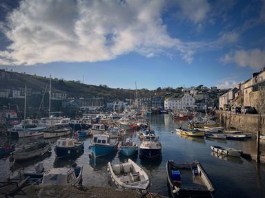 A harbor with various boats and buildings at Chapel Cottage Mevagissey