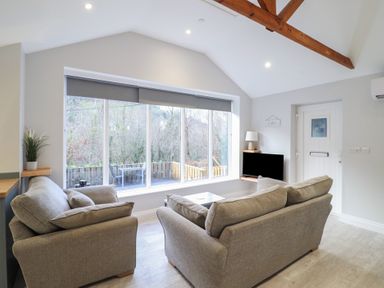 A living room with a couch and coffee table at Lodge at Nadur