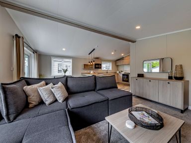 A living room with a sofa and coffee table at Saron 2.0 Pet Llandyrnog