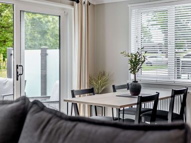 A dining room with a table and chairs at Saron 2.0 Pet Llandyrnog