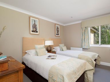 A bedroom with two beds and a window at The Allensford (Pet) Slaley