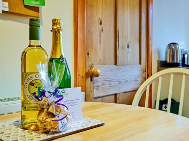 Bottles of wine and a gift on a table at West Lodge in Kirriemuir