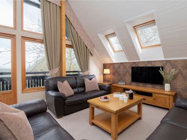 A living room with a sofa and coffee table at The Hexham in Slaley