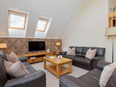 A living room with a sofa and a coffee table at The Hexham in Slaley