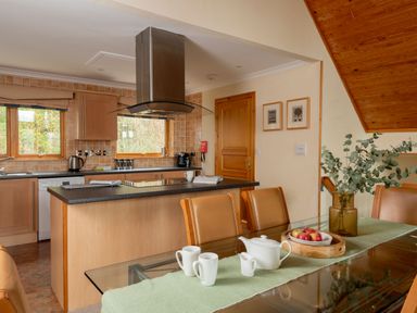 A kitchen with dining table and appliances at The Hexham (Pet) in Slaley