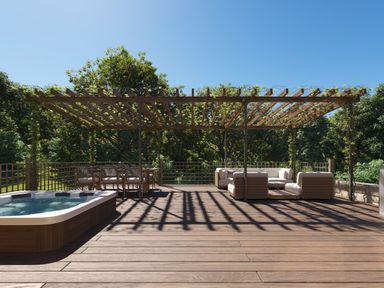 A garden with a hot tub and outdoor furniture at Heatherwood (Pet) in Slaley