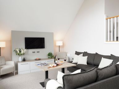 A living room with a sofa and coffee table at The Hexham Spa in Slaley