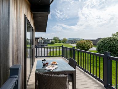 An outdoor patio with a table and chairs at Stokesley (Pet) Great Ayton