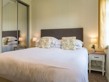 A bedroom with a bed and bedside table at Stokesley (Pet), Great Ayton