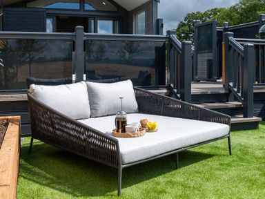 An outdoor seating area with a sofa and refreshments at The Oasis in Great Ayton