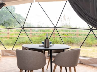A dining area with a table and chairs in The Dome Great Ayton