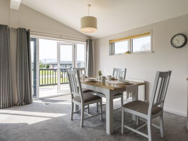 A dining room with table and chairs at Greystone in Great Ayton