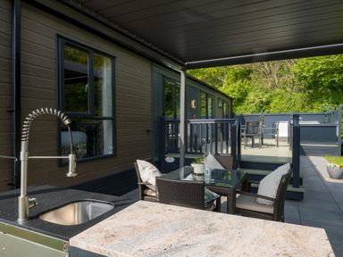 An outdoor area with a table and chairs at The Woods in Great Ayton