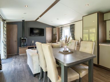 A living room with a dining area and modern furnishings at The Woods in Great Ayton