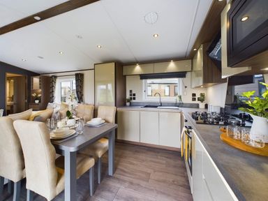 A kitchen with a dining table and chairs at The Woods (Pet) in Great Ayton