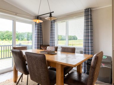 A dining room with a table and chairs at Rosedale in Great Ayton
