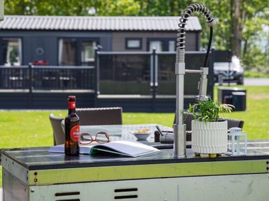 An outdoor patio with a sink and table at Leven (Pet) in Great Ayton