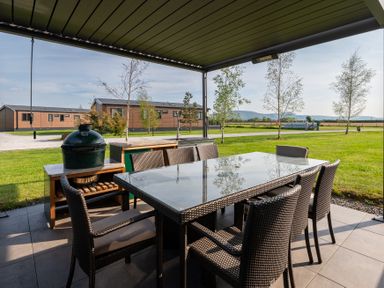 An outdoor dining area with table and chairs at Roseberry in Great Ayton