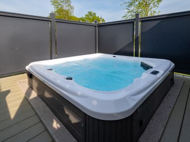 A hot tub on a wooden deck at Roseberry in Great Ayton