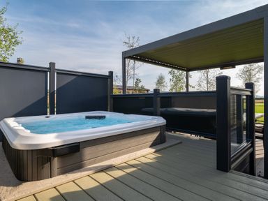 A hot tub on a deck in an outdoor space at Roseberry in Great Ayton