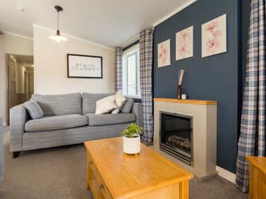 A living room with a sofa and coffee table at Roseberry in Great Ayton