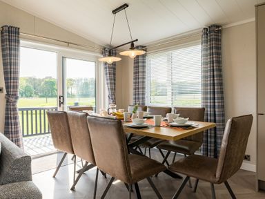 A dining room with a table set for meals at Roseberry (Pet) Great Ayton