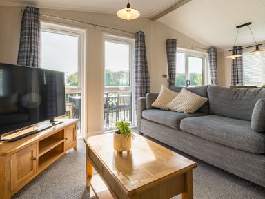 A living room with a sofa and television at Roseberry (Pet) in Great Ayton