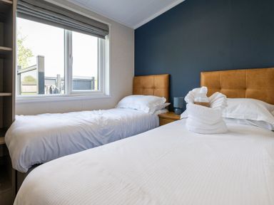 A bedroom with two beds and a window at Roseberry (Pet) in Great Ayton