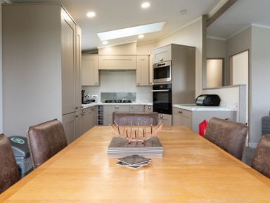 A kitchen with a dining table and appliances at Roseberry (Pet) in Great Ayton
