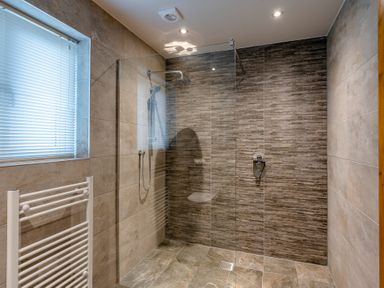 A bathroom with a shower enclosure and towel radiator at Tranquillity 3 (Pet) Carnforth
