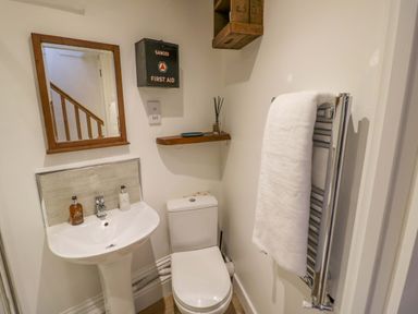 A bathroom with a sink and toilet at Flat 4 Evesham
