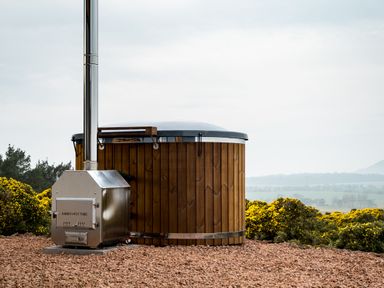 A hot tub with a chimney in a landscape at The Grays in North Berwick